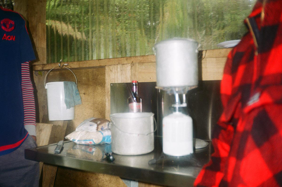 Whisky porridge being made on a gas burner at North Arm campsite in Stewart Island. Photo: Alex Blackwood.